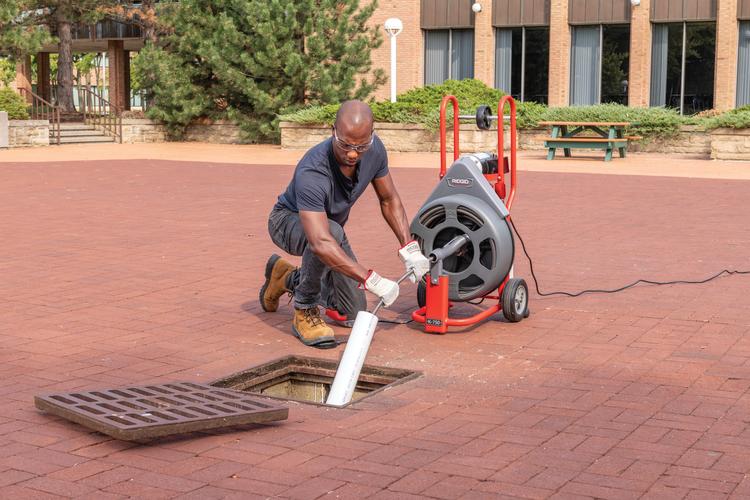RIDGID 83557 K-750R 5/8" (16 mm) Open Cage Drum Machine with 5/8" x 100' (16 mm x 30.5 m) IW Solid Core Cable, 2", 3", and 4" "C" Cutters, P-Trap Cutter, Spade Blade, Tool Box, and Gloves RIDGID